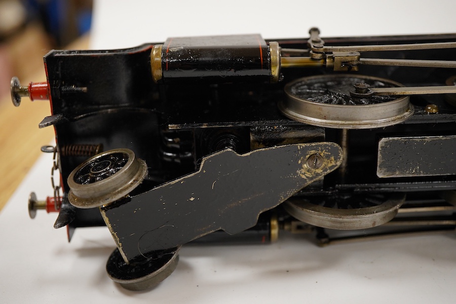 An 0 gauge Bassett-Lowke live steam spirit fired tinplate BR 2-6-0 Mogul tender locomotive, 42980, with original fuel tank and burner, two controls in the cab accessed through the cab roof